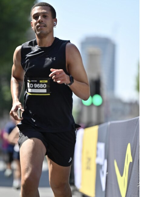 Client running in a road race after building endurance through coaching